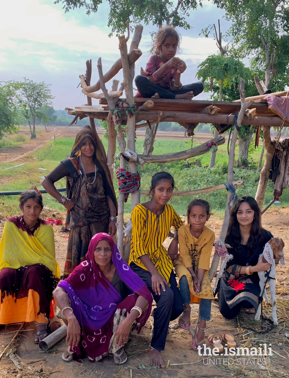 Helping the children with their homework in their favorite sanctuary, the handcrafted treehouse, where learning and comfort thrive together.