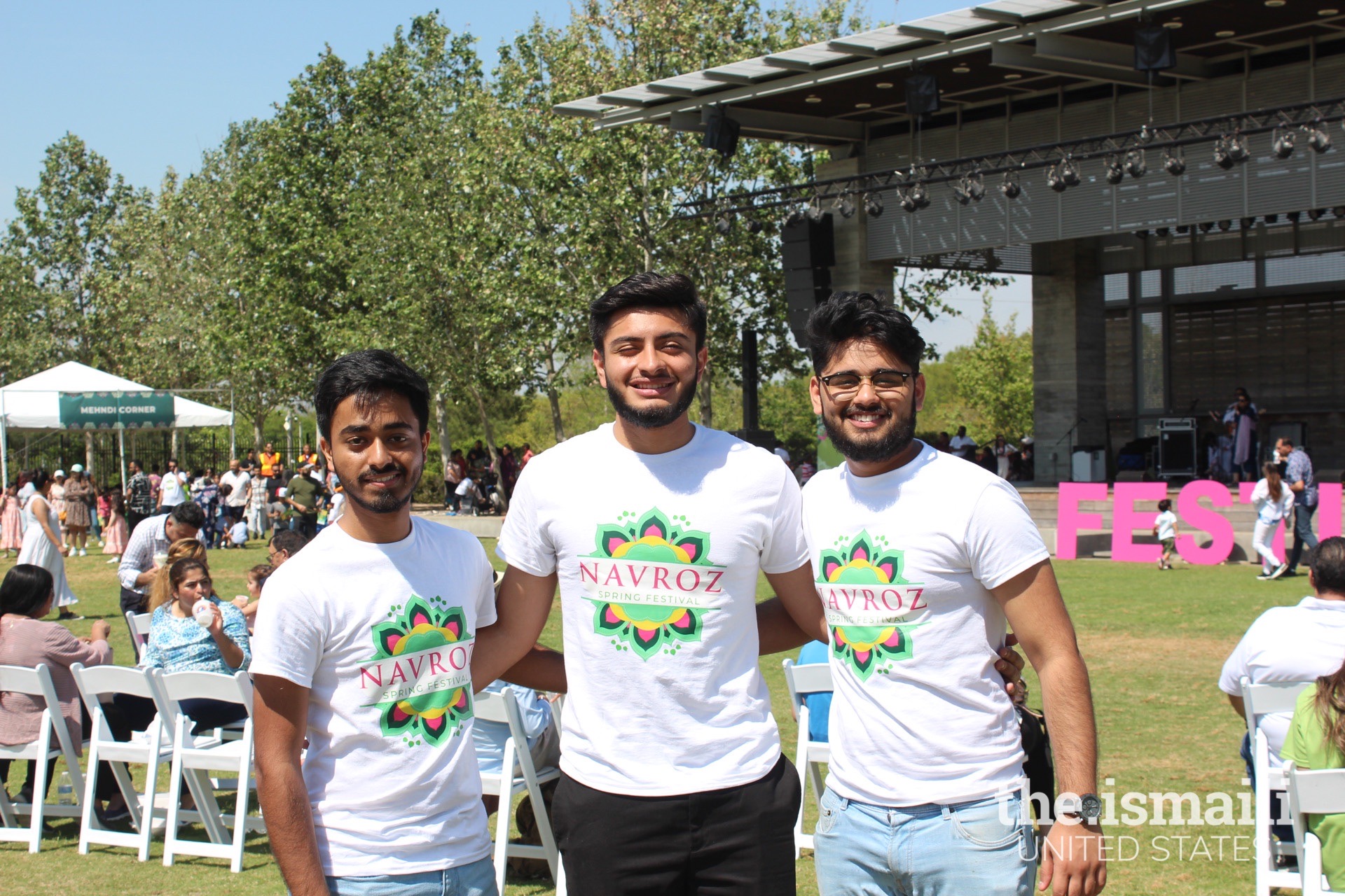 Volunteers at the Navroz Festival posing in front of the stage