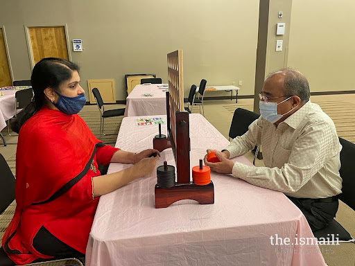 Seniors at Duluth Jamatkhana playing minute-to-win-it games.