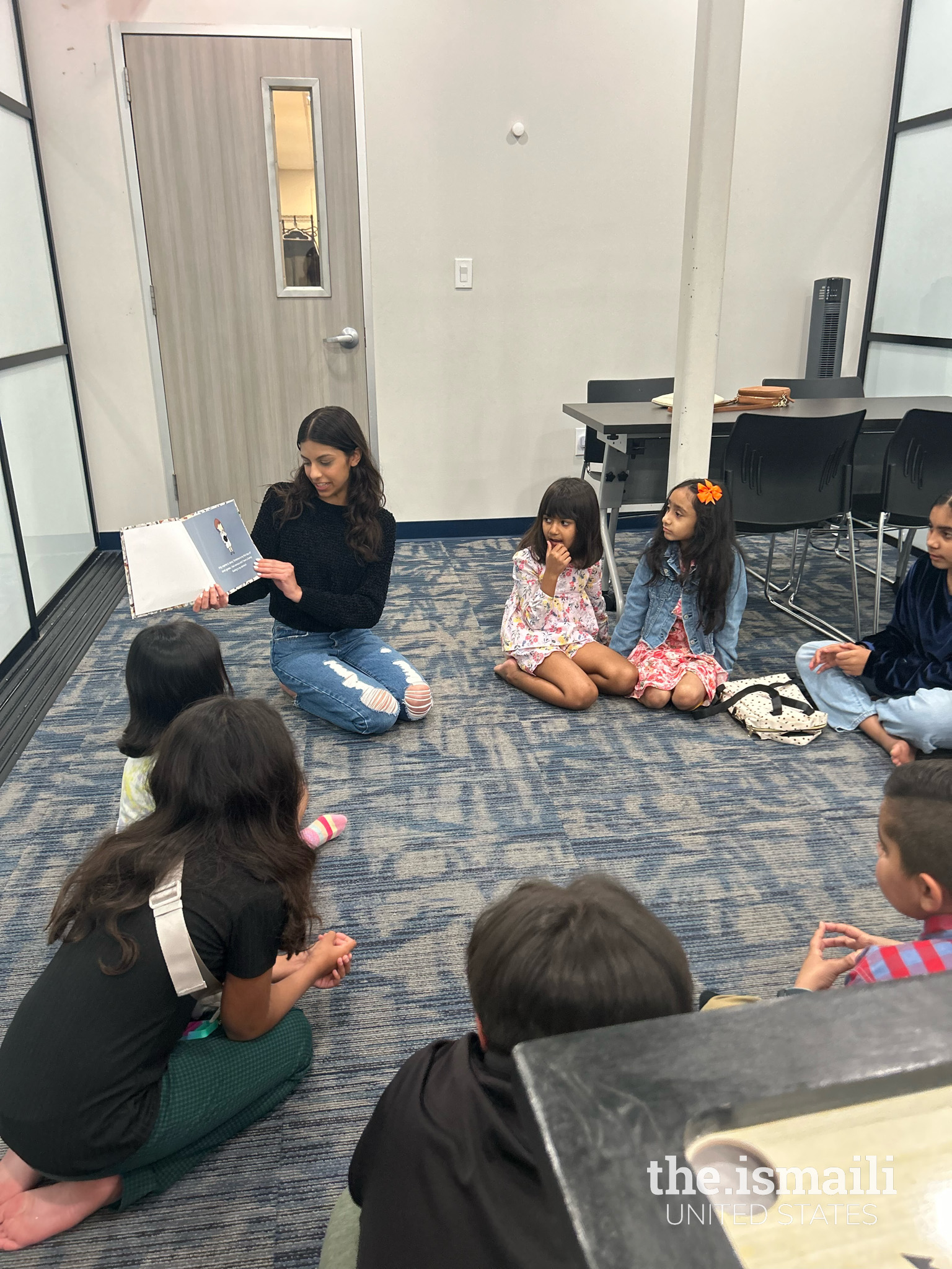 Zaha reading her book “Butterflies in My Stomach” and facilitating a conversation about mental health among KG REC students.