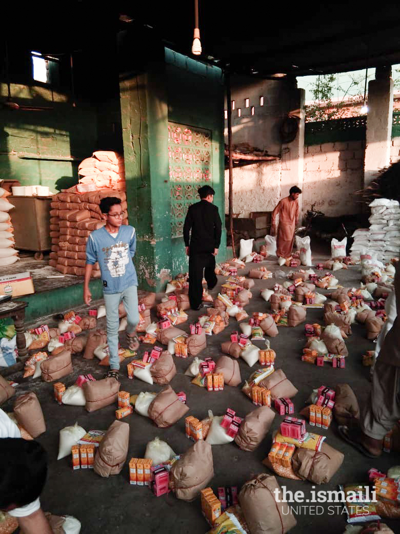 Volunteers of KWA prepare rations packages (food supplies) to provide aid for those impacted by COVID-19 in rural areas.