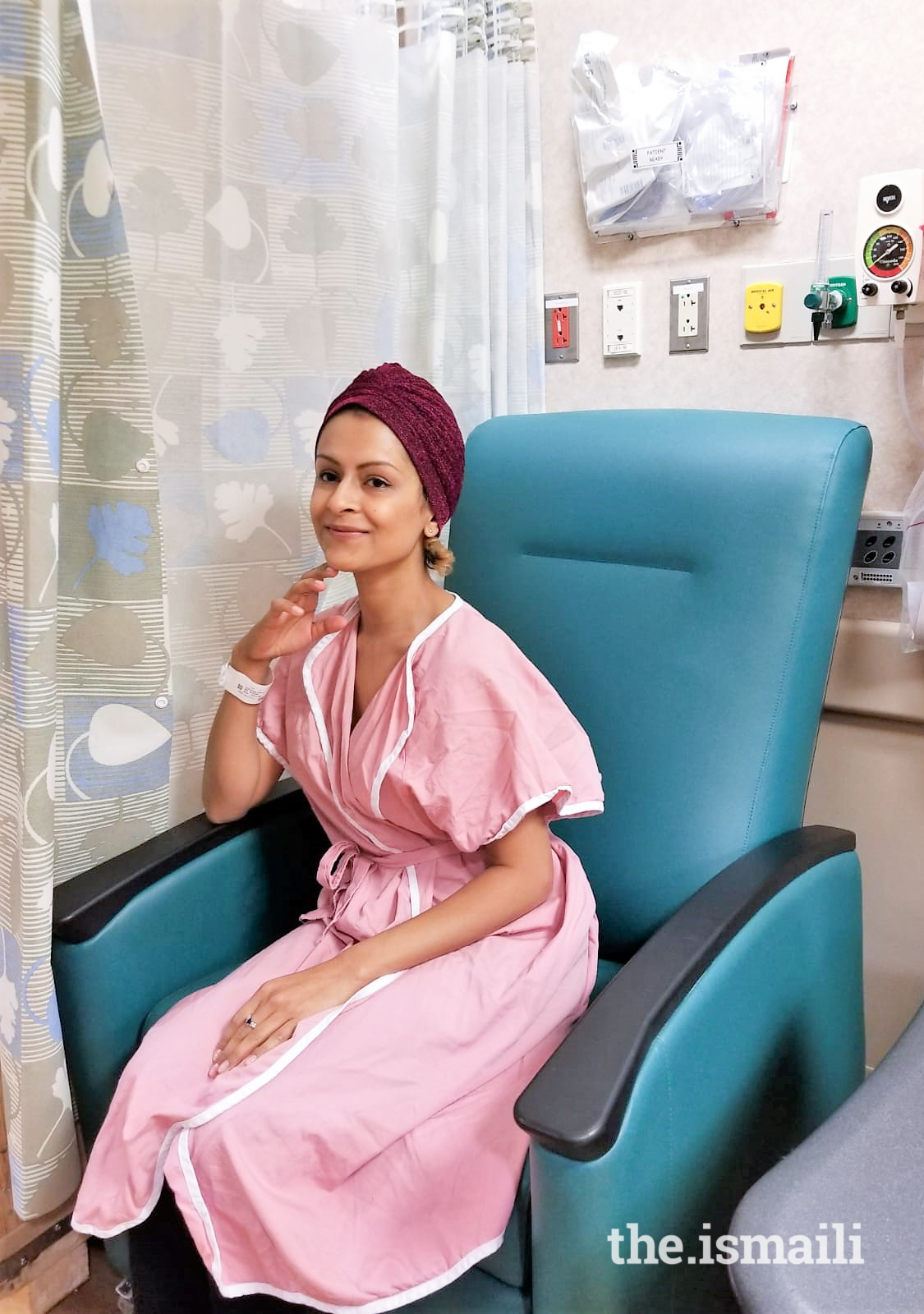 Sonya posing with her fashionable head-wrap at one of her maintenance treatment sessions.