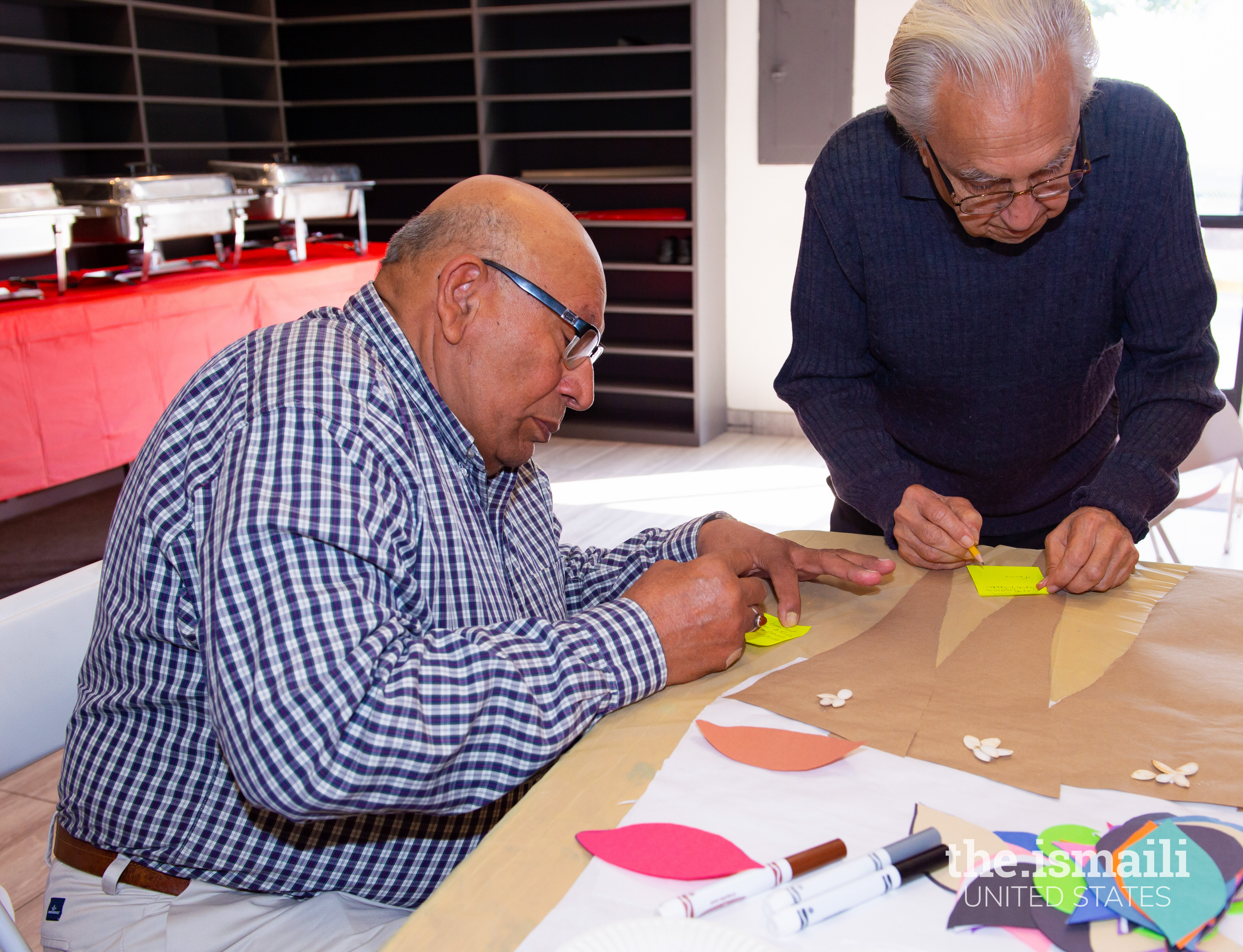 Santa Monica Jamatkhana seniors making a gratitude tree together.