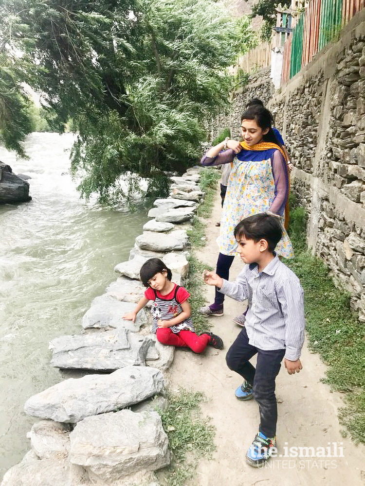 Nighat’s daughter playing with her cousins in Chitral. One can see the risk of danger from the fast-flowing water