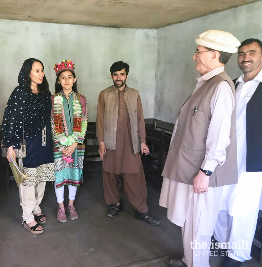 Nighat and her daughter with Mr. Islamuddin, the principal of Pamir Public School in Garam Chashma, where she funded an ECD center