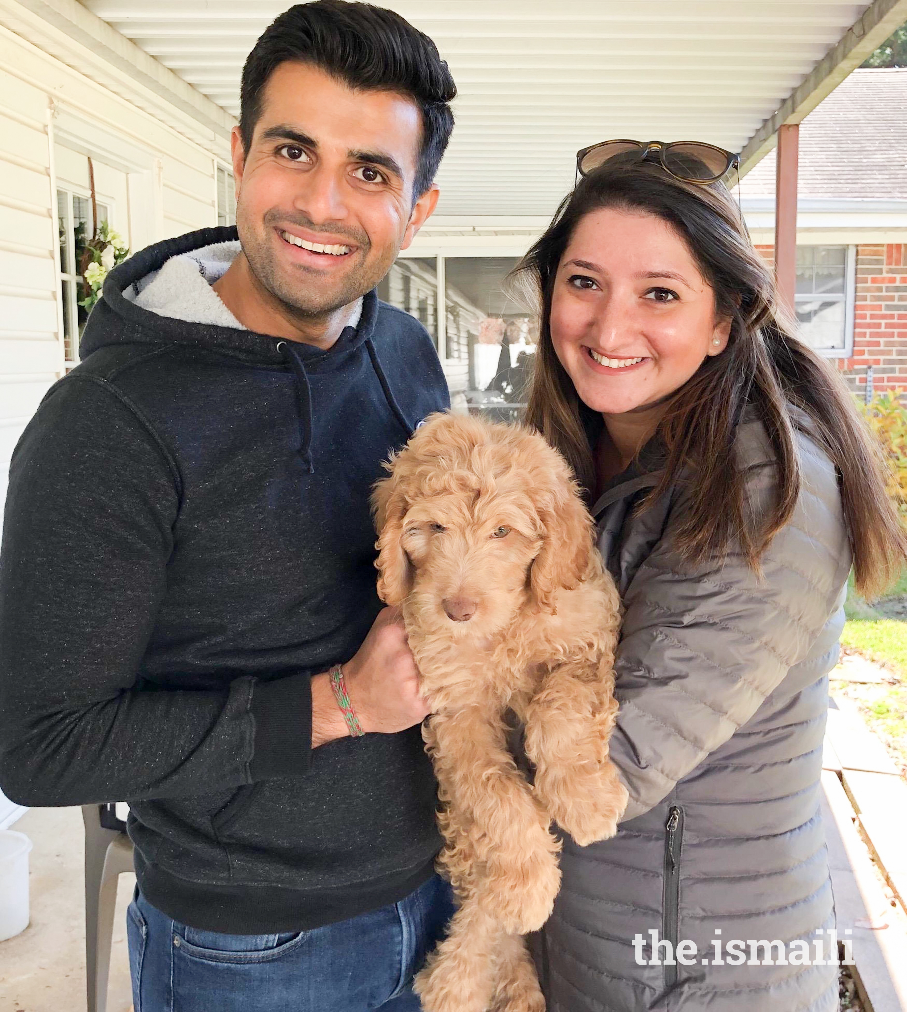 Dr. Nazia Kabani with her husband, Sameer Ratani, and pet, Archie.