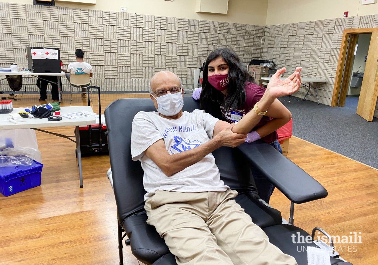 Dr. Sadrudin Sarangi and his granddaughter, Ariana Virani, at the Atlanta Northwest Jamatkhana Interfaith Blood Drive.