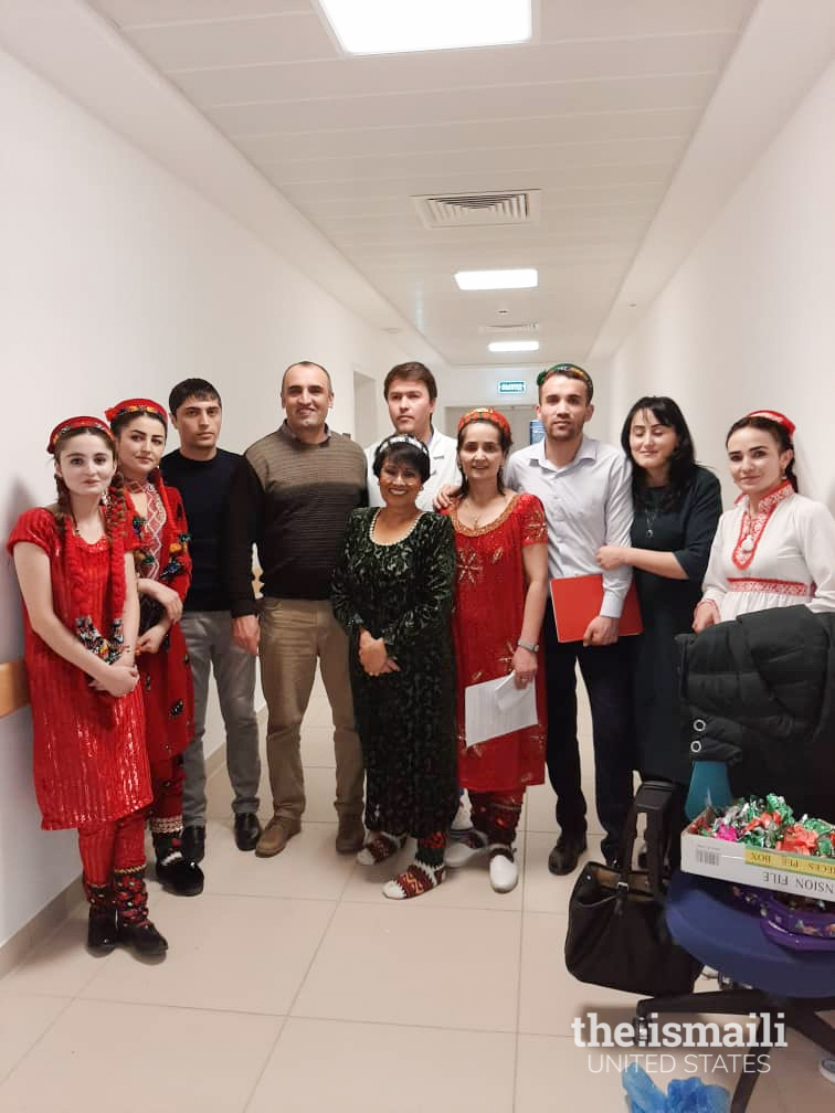 Yasmin Walji (center) celebrating Dec 13, 2019, Mawlana Hazar Imam’s birthday and one year of the opening of the Outpatient Department with AKMCK team members.