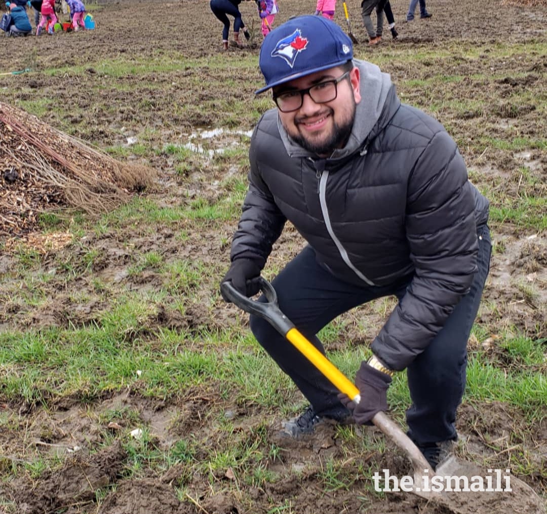 Zakyr volunteering at an Ismaili CIVIC tree-planting event in Ajax, Ontario.