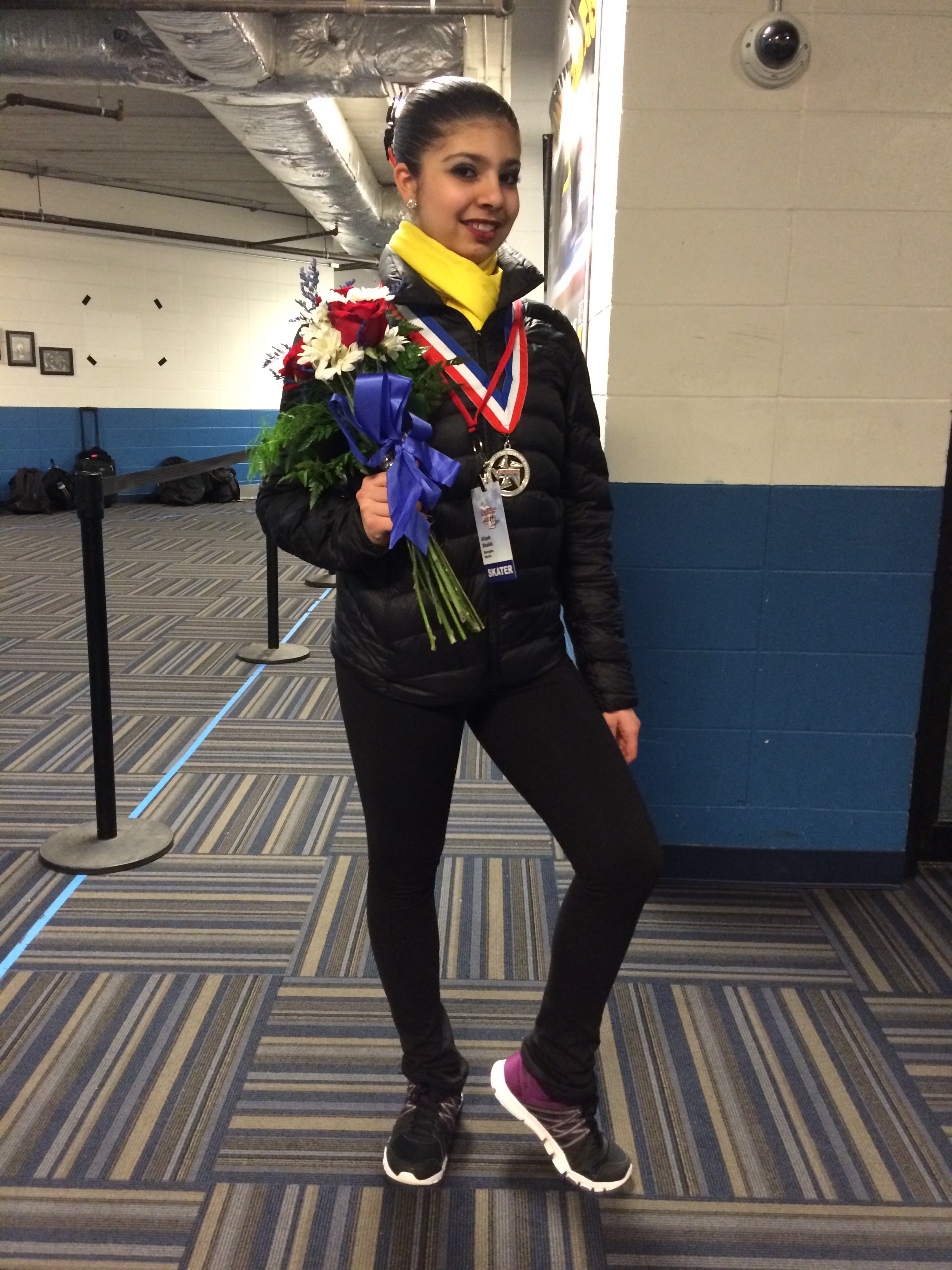 Aliyah Shaikh receiving the silver medal at the novice level for synchronized figure skating in Kalamazoo Michigan, 2016