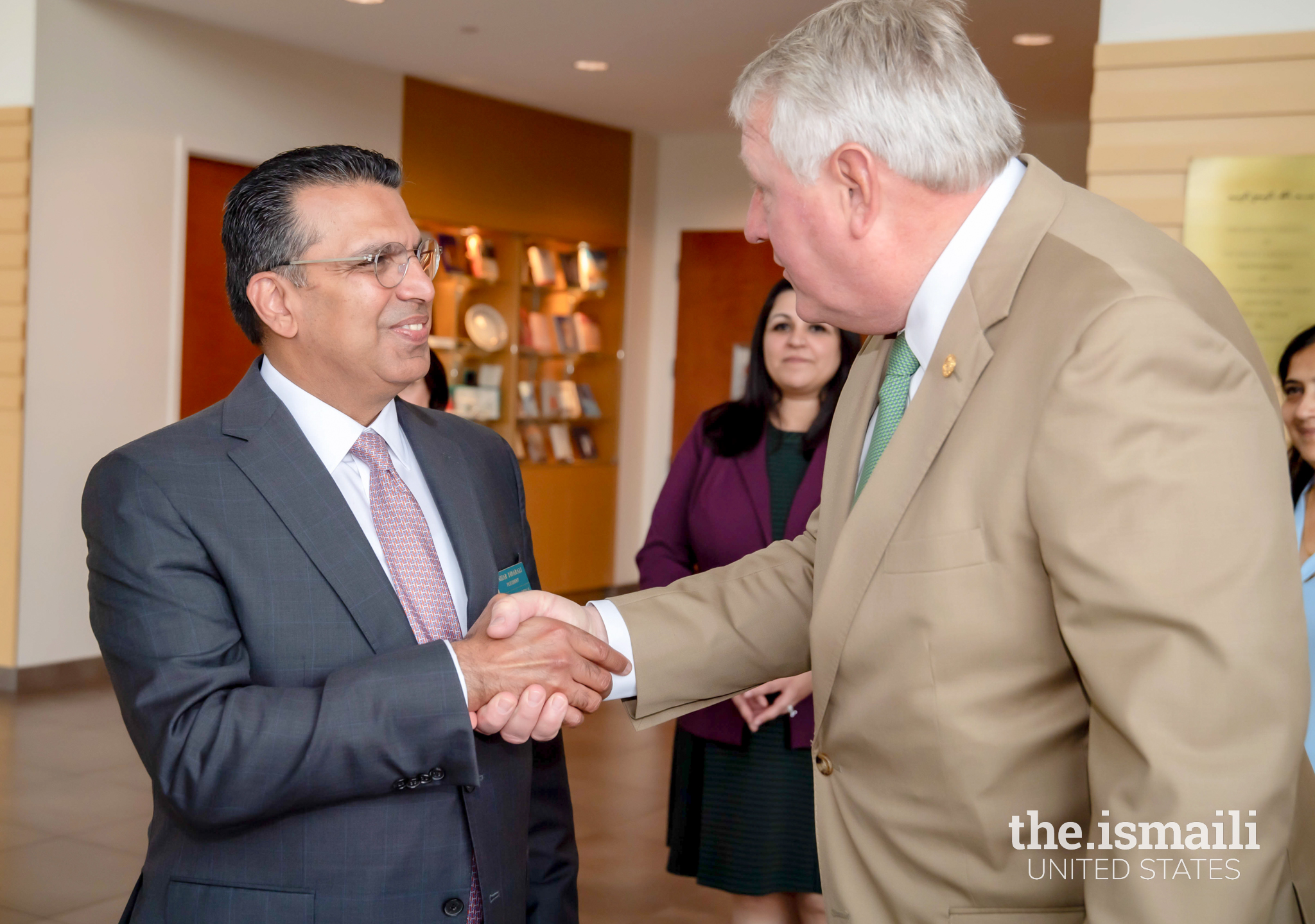 President of the Ismaili Council for Central USA, Nizar Didarali, greets Texas Secretary of State John B. Scott at the Ismaili Jamatkhana Plano.