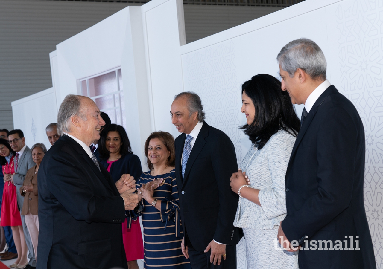 Mawlana Hazar Imam shares a light moment with Jamati leaders before concluding his Diamond Jubilee visit to Canada.