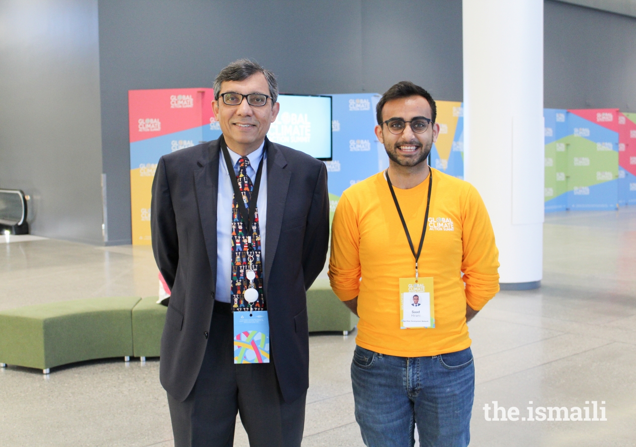 Dr. Zulfiqar Bhutta accompanied by an Ismaili Volunteer, Saad Hirani, at the GSAC.