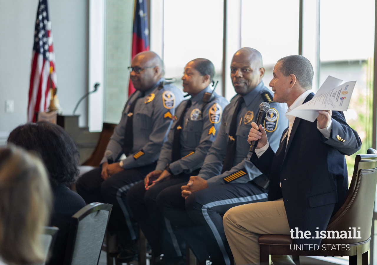 Marc Cohen, Chief of the Gwinnett Police Citizen Advisory Board, moderating a panel discussion on crime and safety with three distinguished officers from the Gwinnett County Police Department: (From right) Chief James D. Mcclure, Sergeant Selena Francis, and Corporal Joseph Mathias.