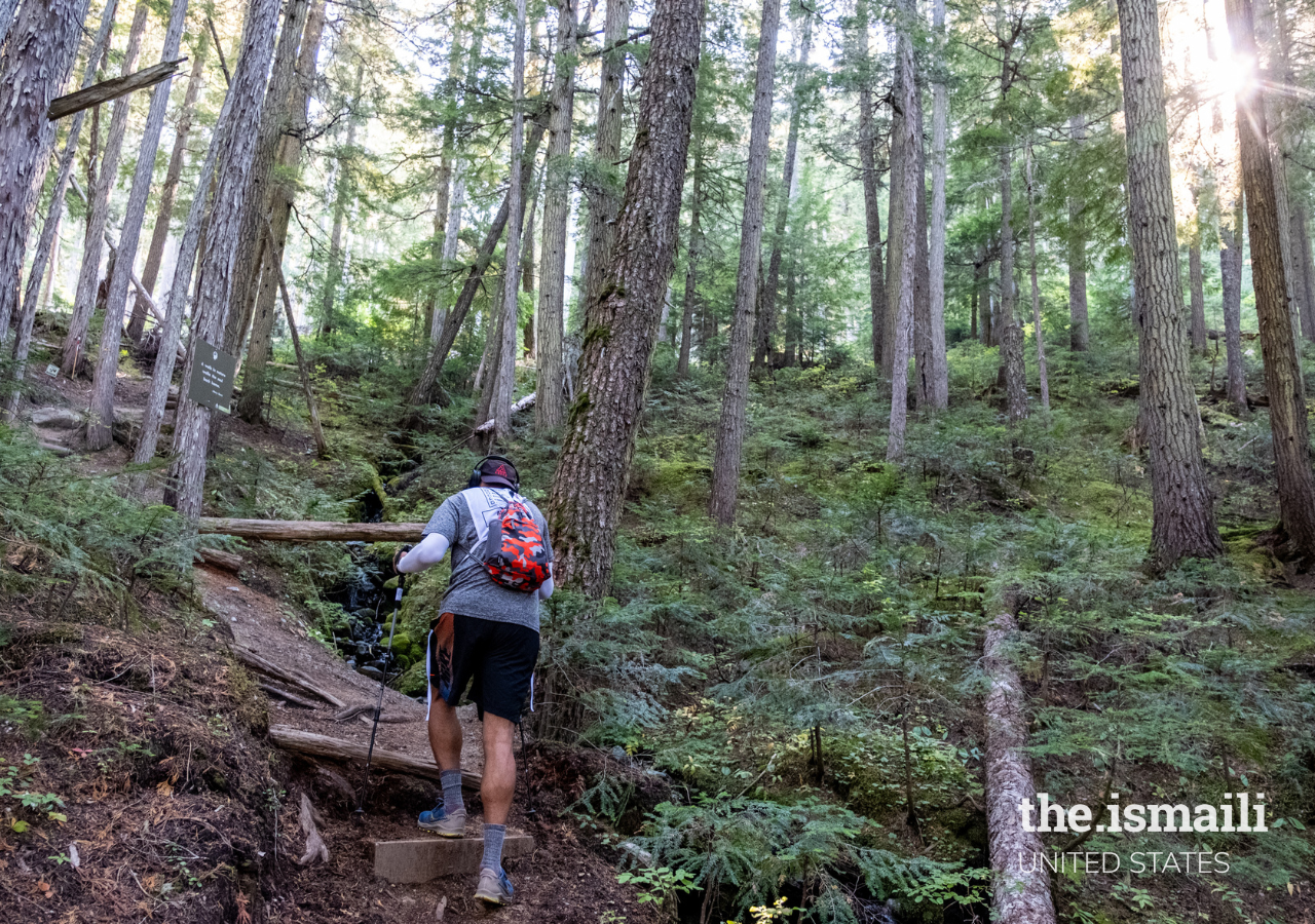 Akbar tackling a steep ascent through the woods.