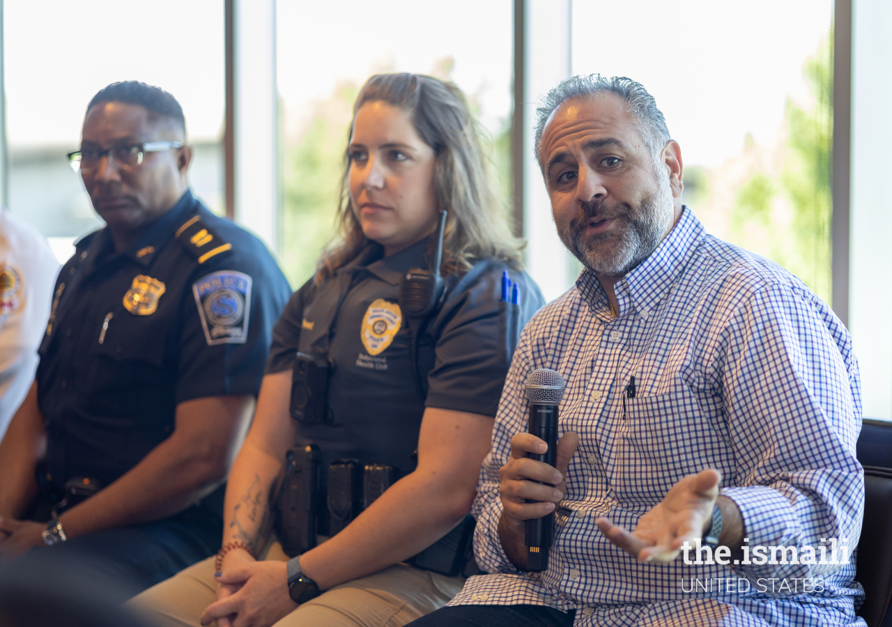 Pej Mahdavi, Licensed Clinical Social Worker at View Point Health Behavioral Health Unit, facilitates the conversation about mental health prevention and services in the community as Corporal Tracey Reed and Captain Dwayne Black look on. 