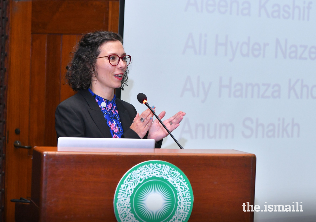 Miriam Kugele, AKU's global senior manager for environment and sustainability, applauds participants.