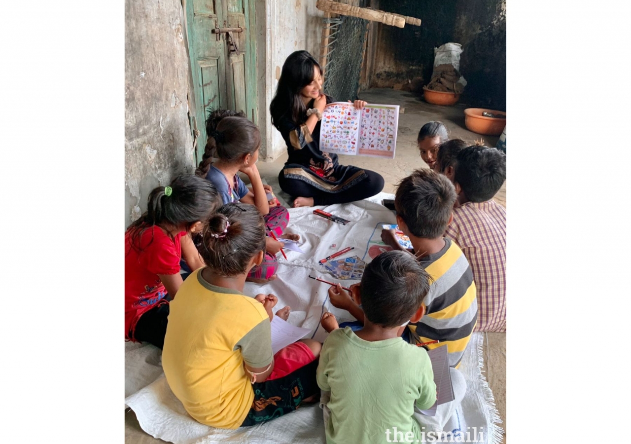 Soha begins the first day of class by familiarizing the children with fundamental English vocabulary words.