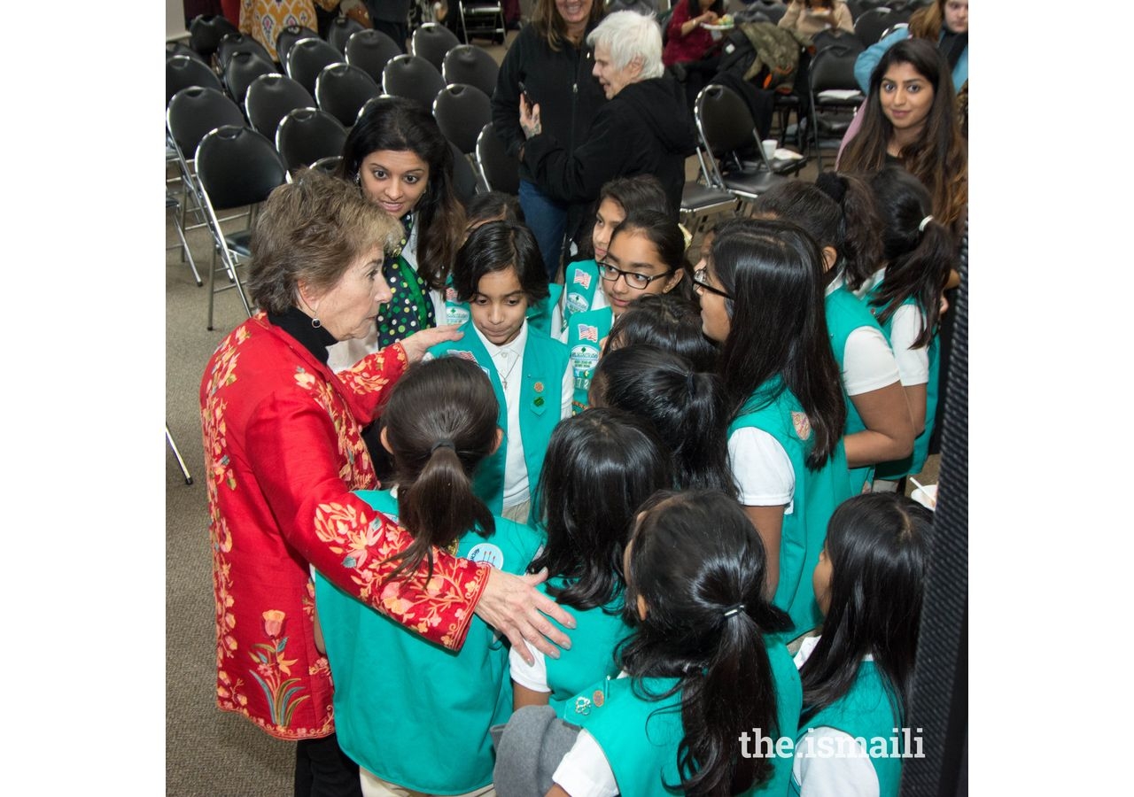 Congresswoman Jan Schakowsky with Ismaili Muslim Girl Scouts at the Thanksgiving event held at the Ismaili Jamatkhana, Glenview, Illinois.