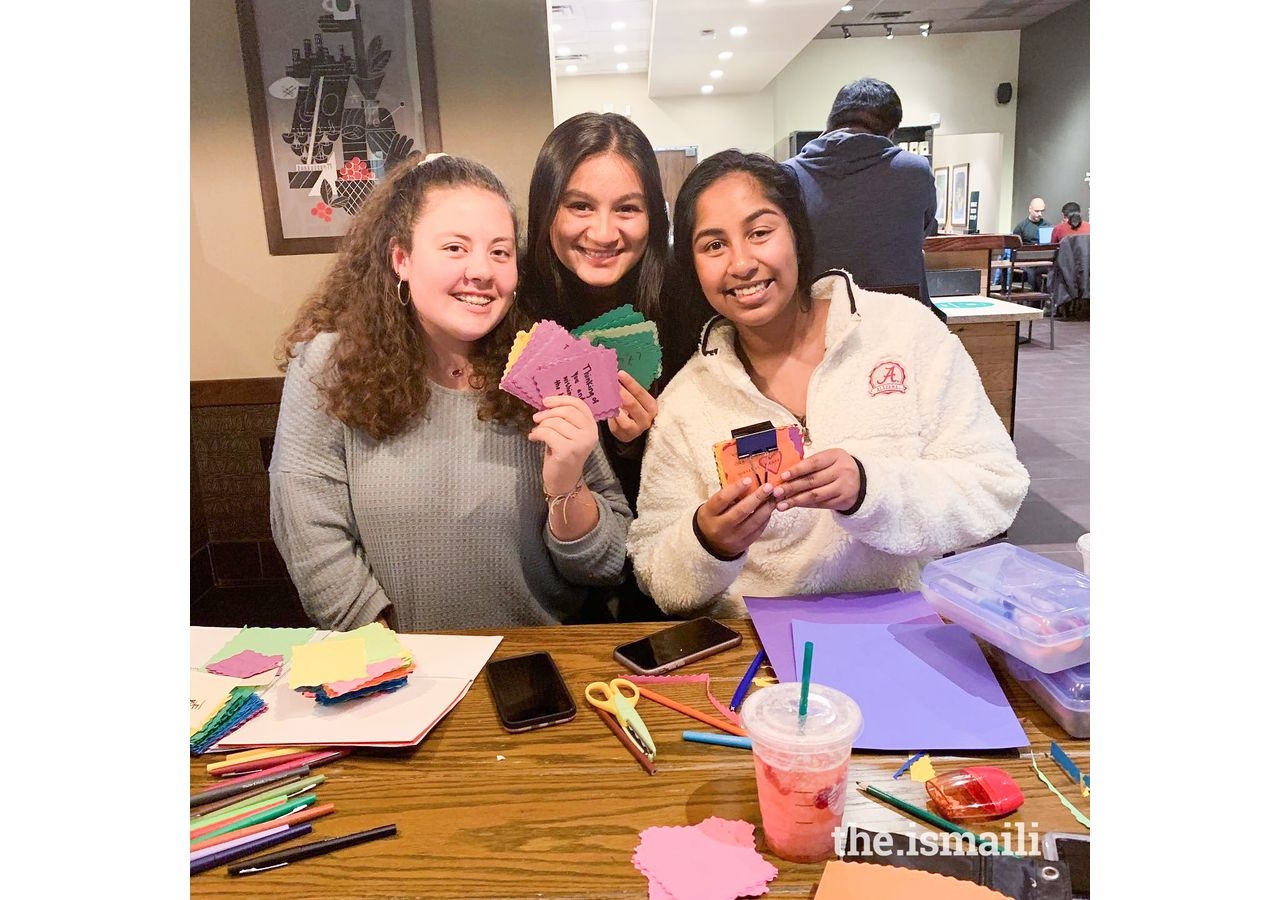 Sarah Ali working with her volunteers to create motivational cards for Vijiti.