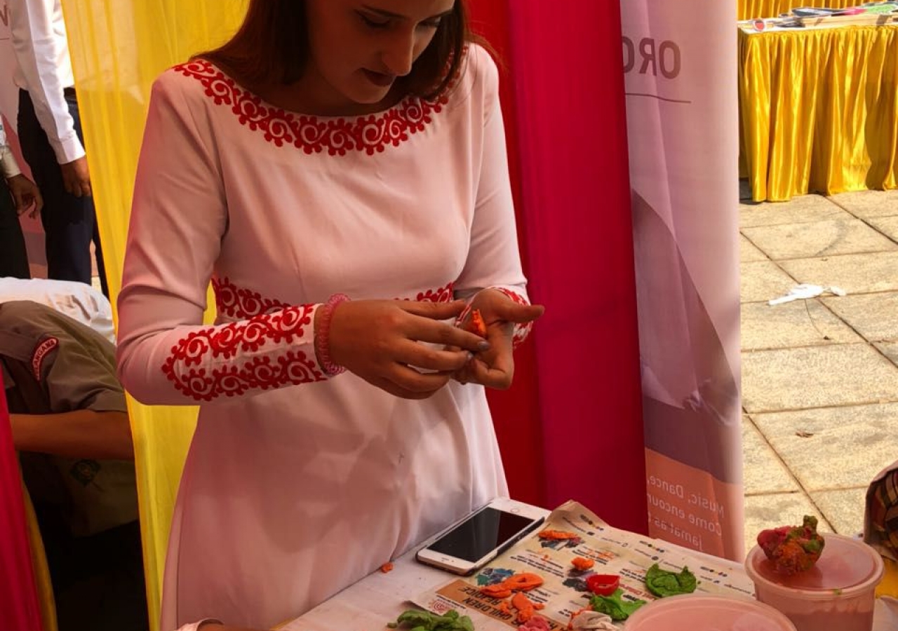 A participant at the Jubilee Arts festival in Hyderabad engrossed in creating a piece of Art.