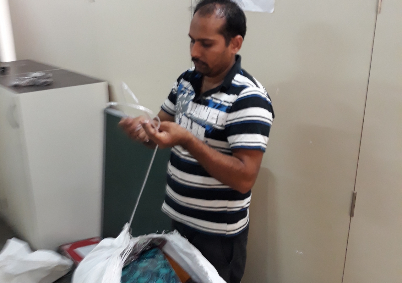 A volunteer packing the items for transportation to Kerala