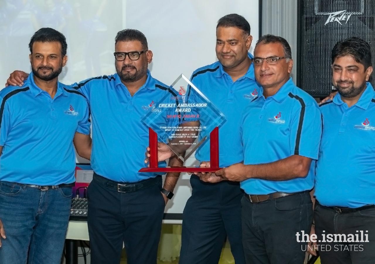 Cricket Ambassador Award that Shafiq received with his Cricket America co-founders and administrators.