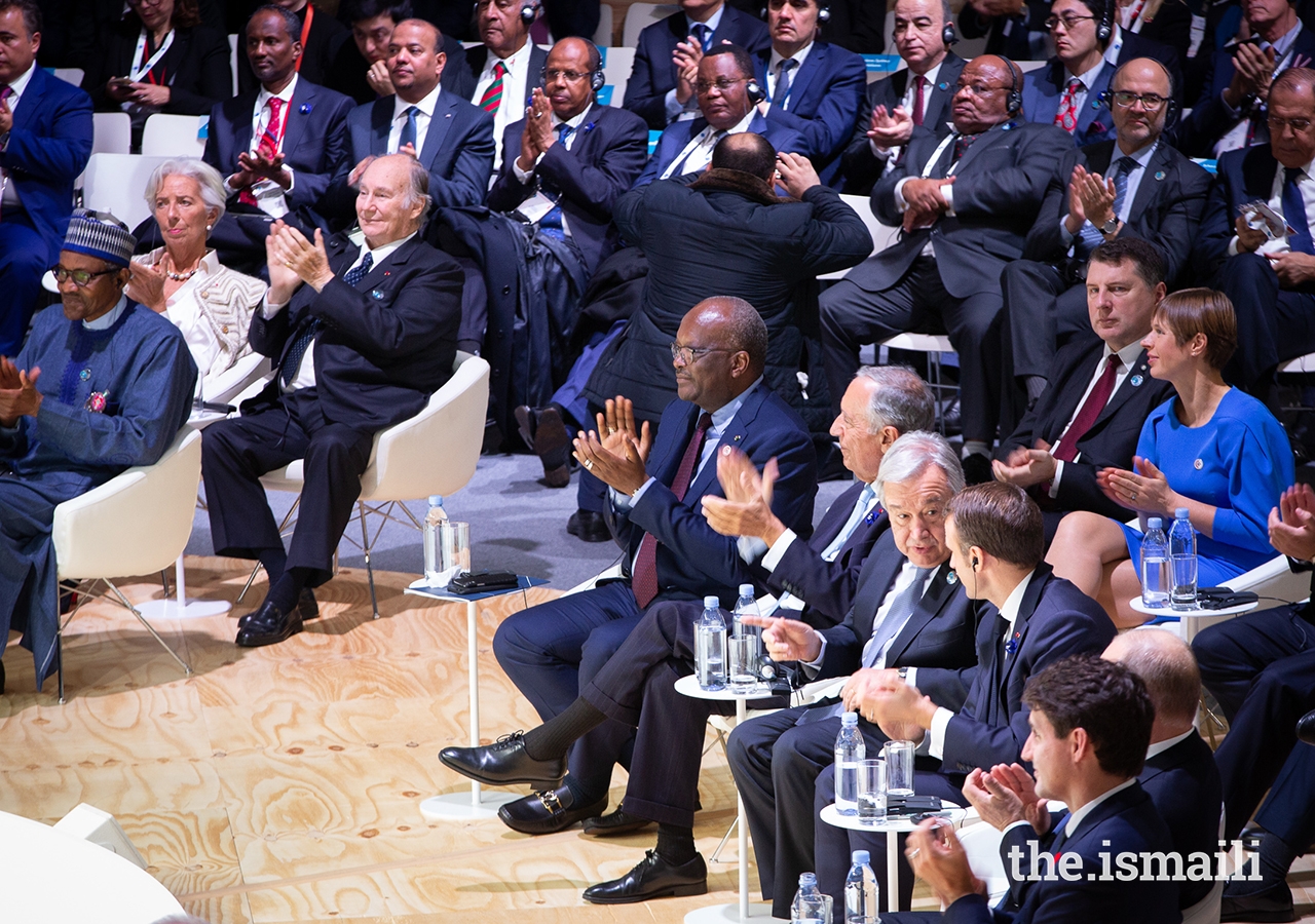 Mawlana Hazar Imam and world leaders applaud as Germany’s Chancellor Angela Merkel concludes her address to the inaugural Paris Peace Forum.