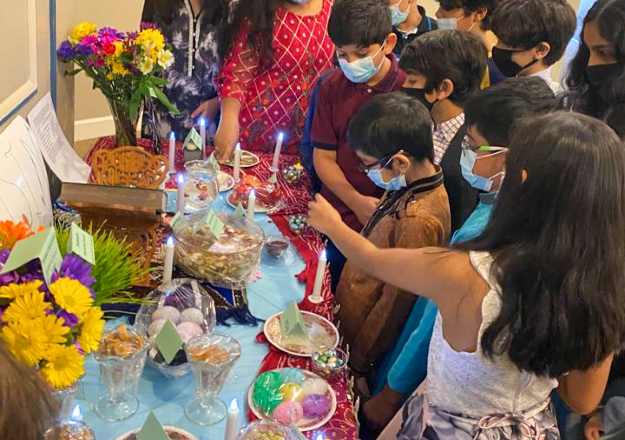 Religious Education students exploring the Haft-Sin table at Atlanta Headquarters Jamatkhana.