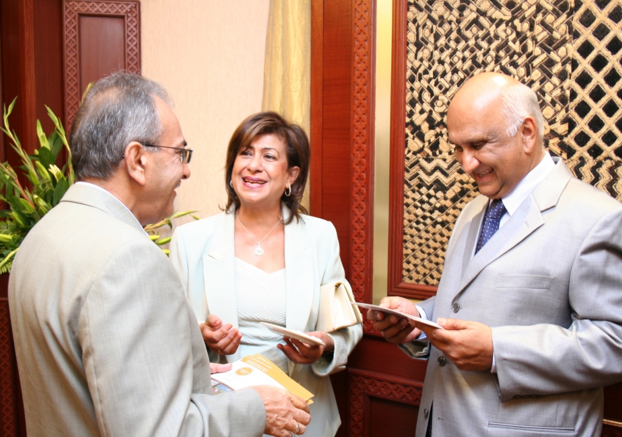 Following the launch, guests admire the First Day Covers of the commemorative stamps. 