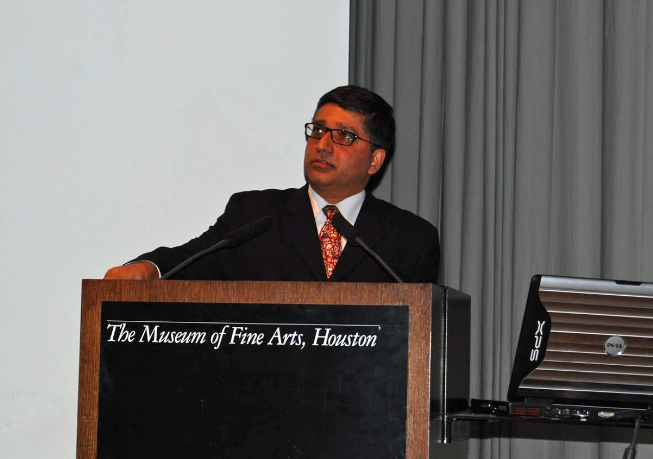 Alnoor Merchant addresses the audience at the Museum of Fine Arts in Houston.