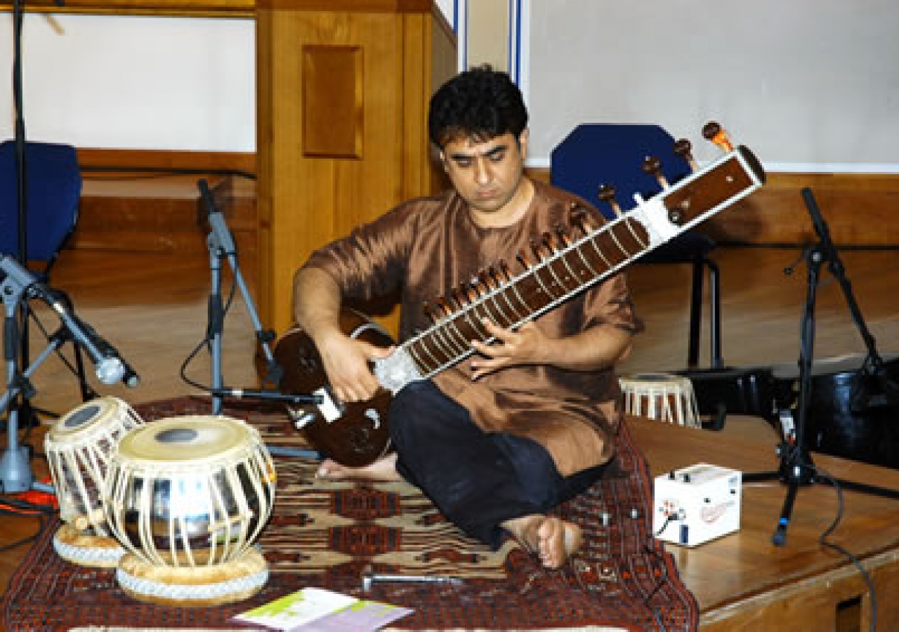 Mohammed Assani plays the sitar during the performance of MAQAM 