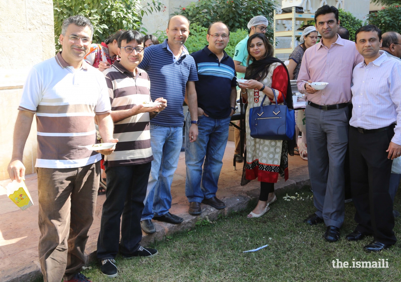 Members of the Jamat enjoying a delicious snack during the Mela