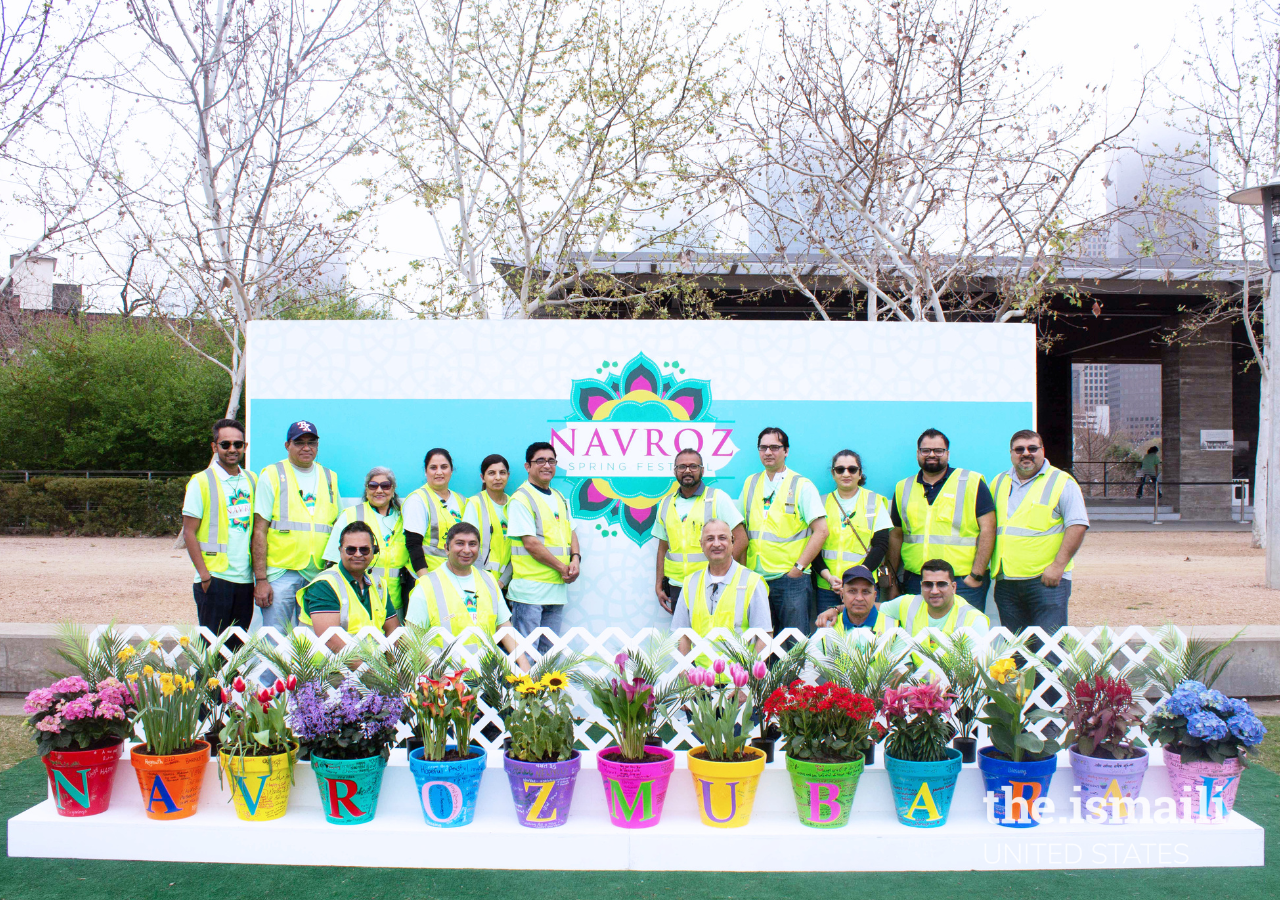 Security and Safety Volunteers wishing the Jamat Navroz Mubarak in front of the One Jamat Navroz Project