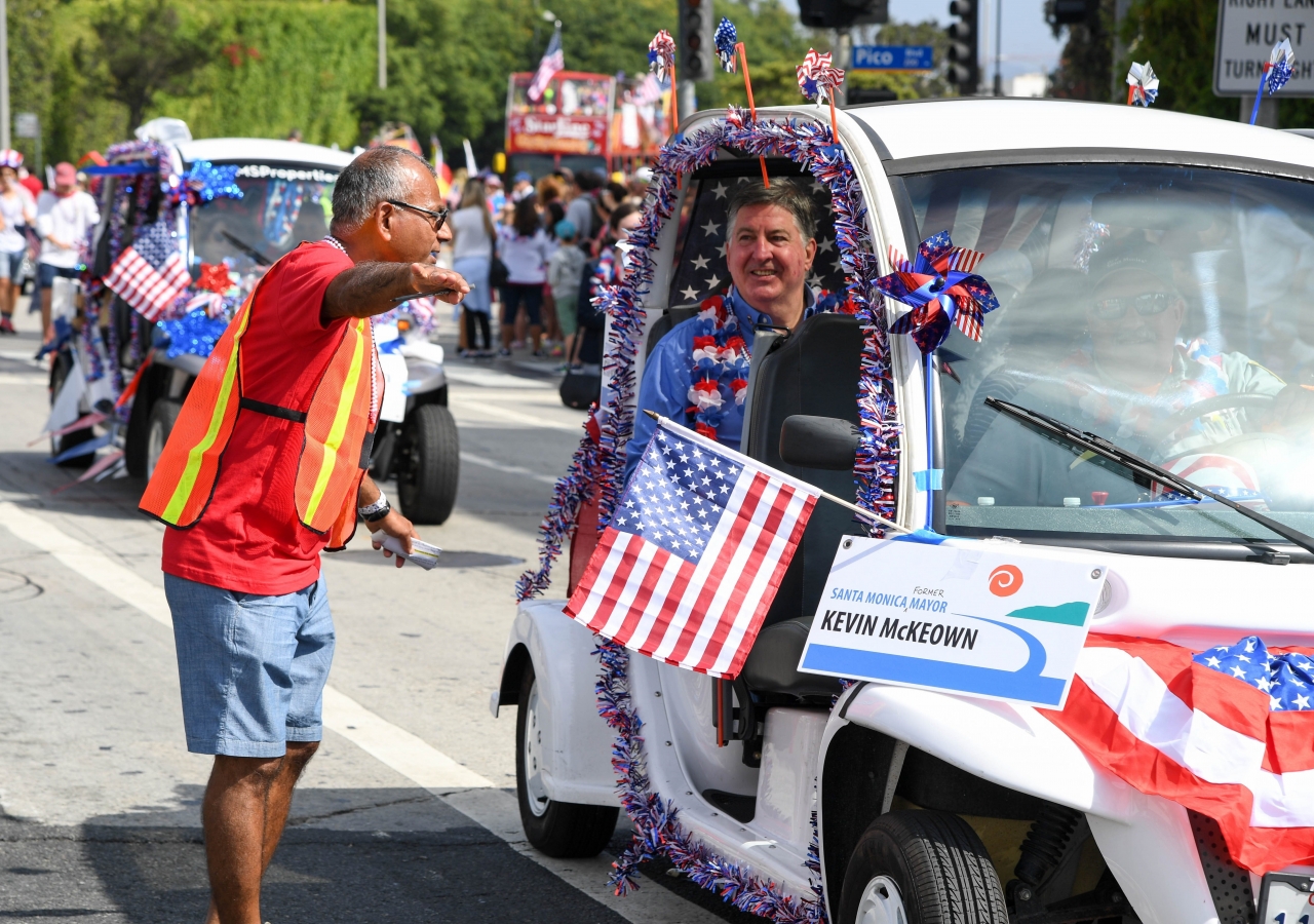 Karim Gowani directing traffic, and speaking with Kevin McKeown, former Mayor of Santa Monica. 