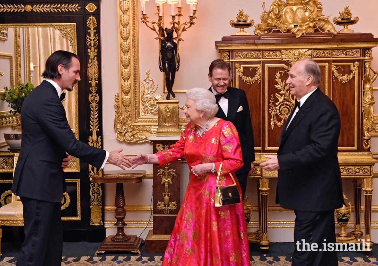 Mawlana Hazar Imam introduces Her Majesty the Queen to his eldest son Prince Rahim.