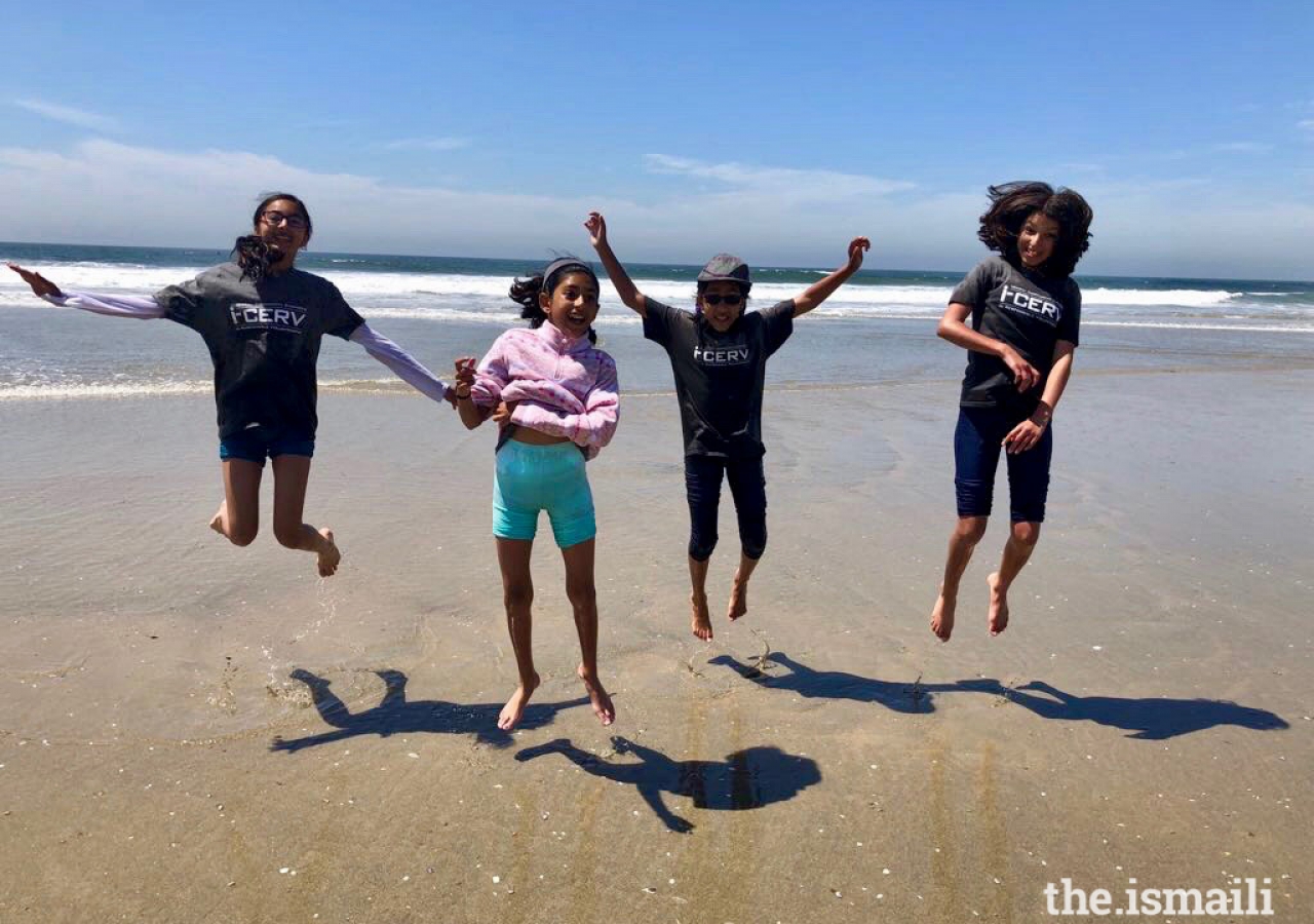 Volunteers having fun cleaning up Huntington Beach, CA.