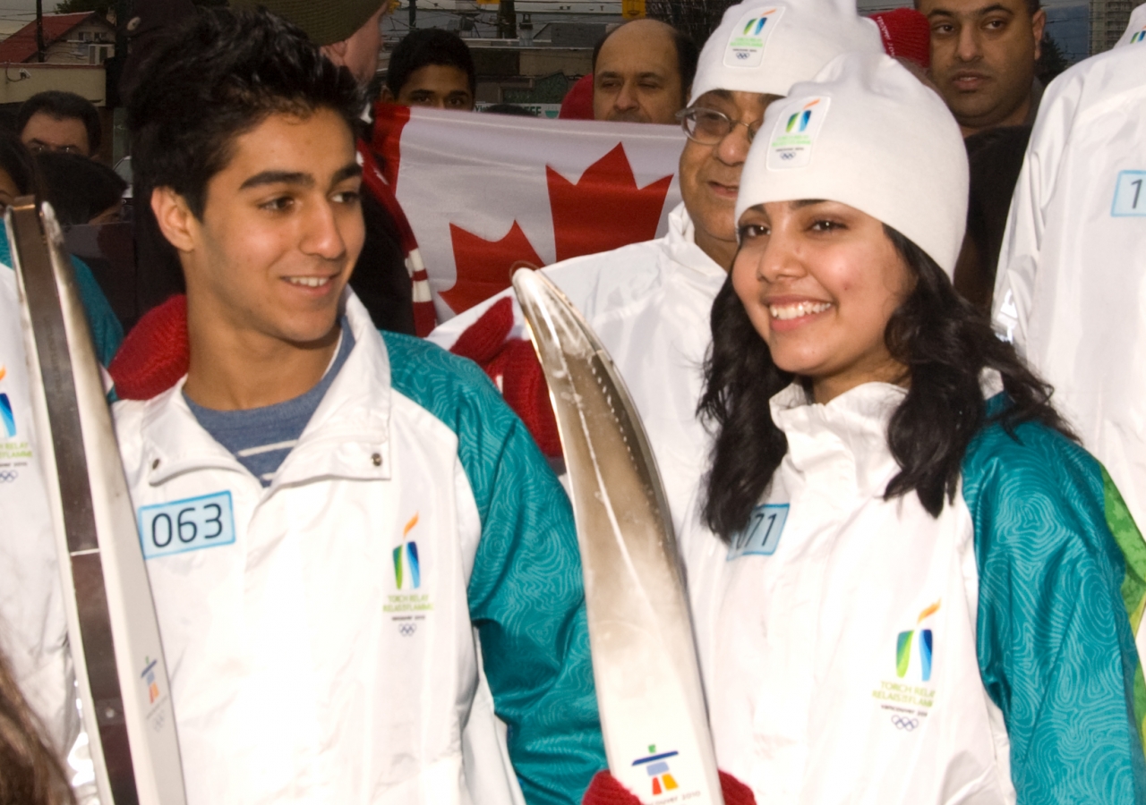 Darbir Rashid and Zoya Jiwa celebrate after their torch run.