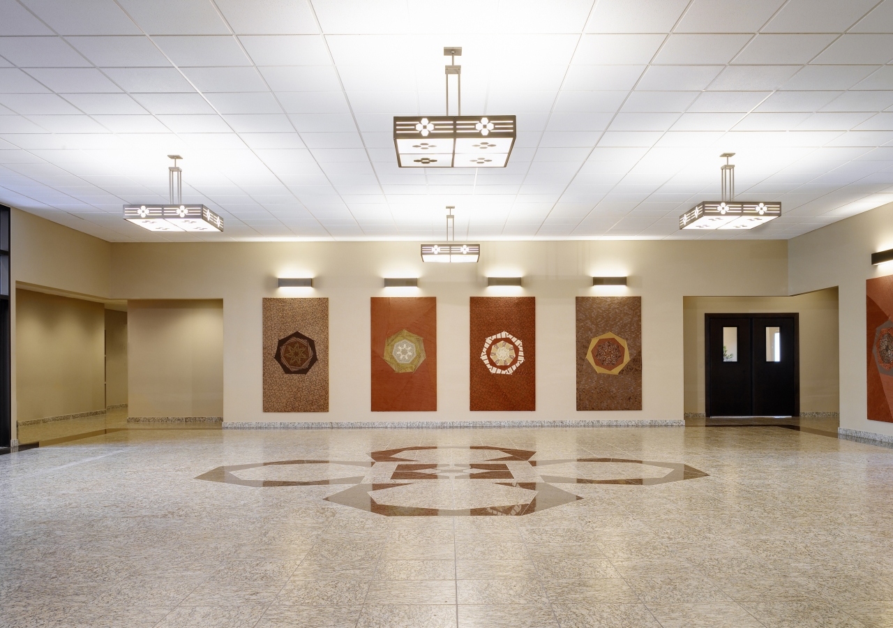 Social Lobby with handcrafted tapestries and heptagonal motif inlays.