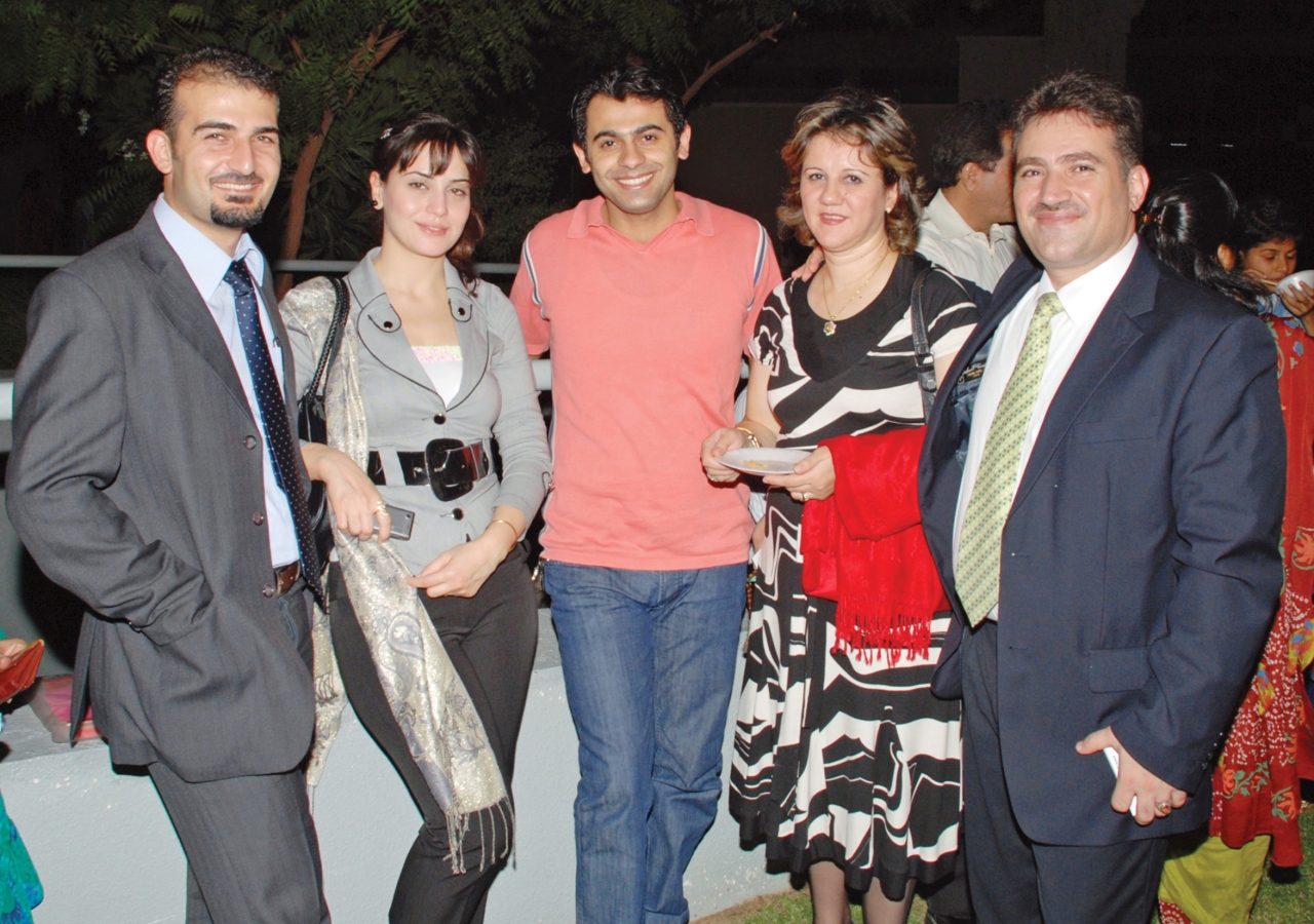 Jamati members from Syria have a taste of Golden Alliance-prepared food at the food mela.