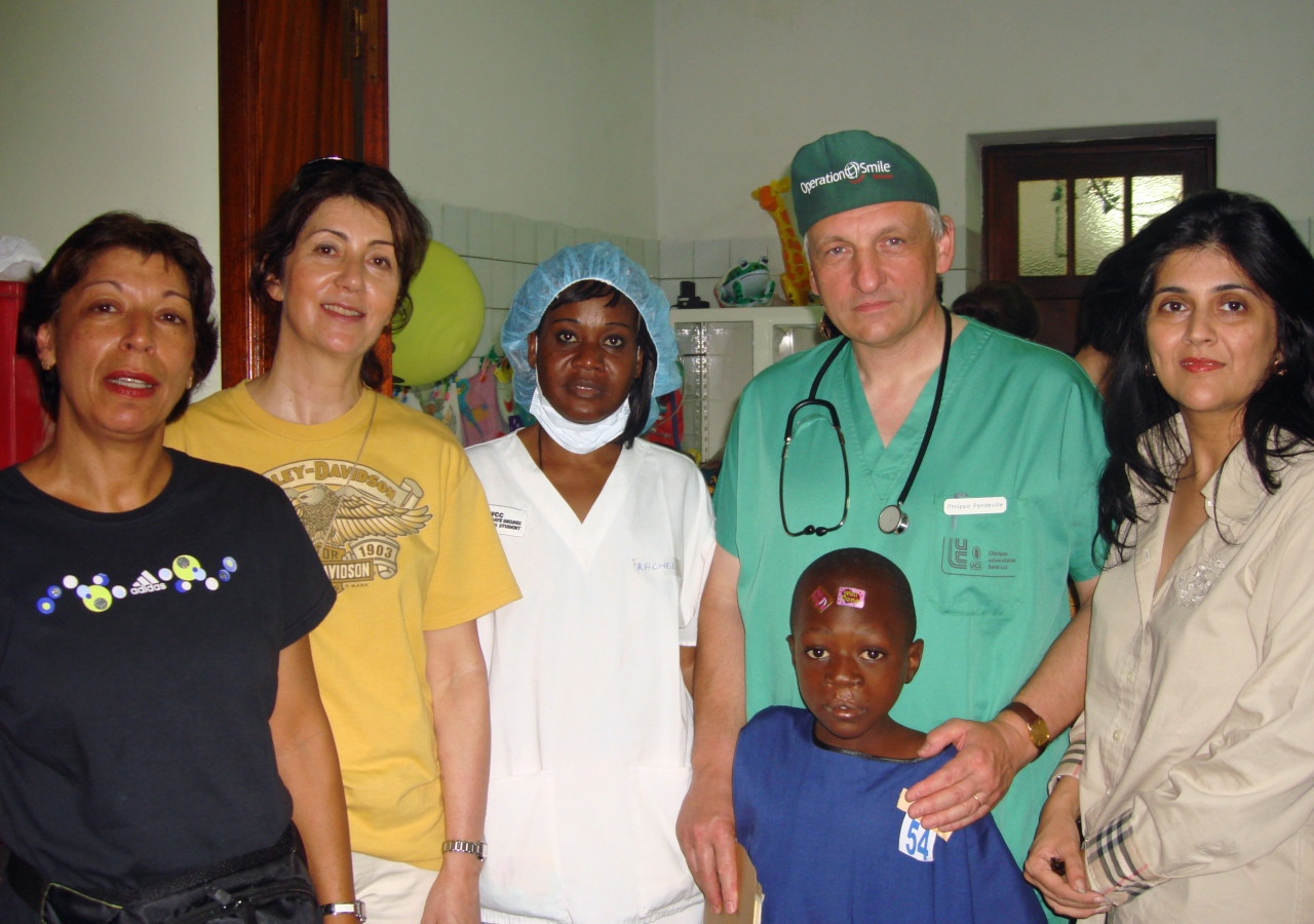 Nargis Manji (far left) and Shamshad Haji (far right) together with some of the Operation Smile team members and a young patient who is scheduled for surgery. The pair were instrumental in arranging for the medical mission in Kinshasa.