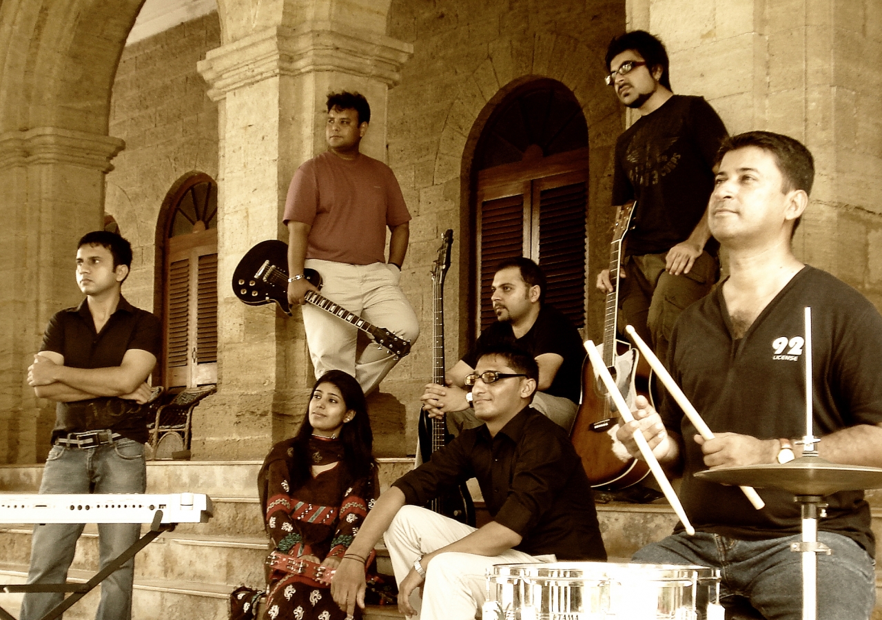 Members of the Salimahabad Orchestra. From left to right: Amirali Meghani, Naveed Rajput, Sadaf Faiz, Asif Noorani, Rahim Sundrani, Sohail Noorani, and Rafiq Vadivala.