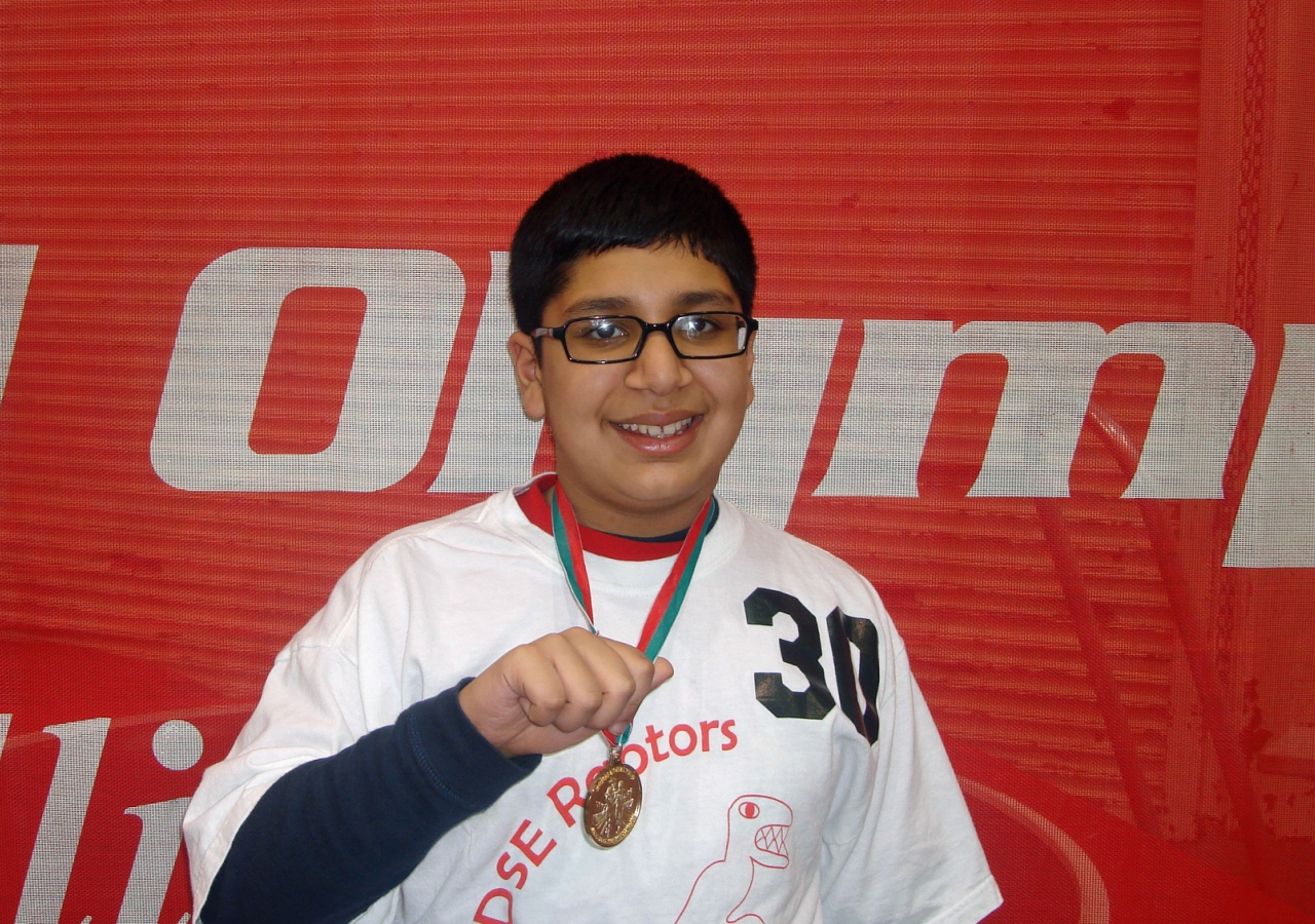 Asad smiles after winning the Gold Medal in Basketball Individual Skills at the 2010 Illinois State Special Olympics.