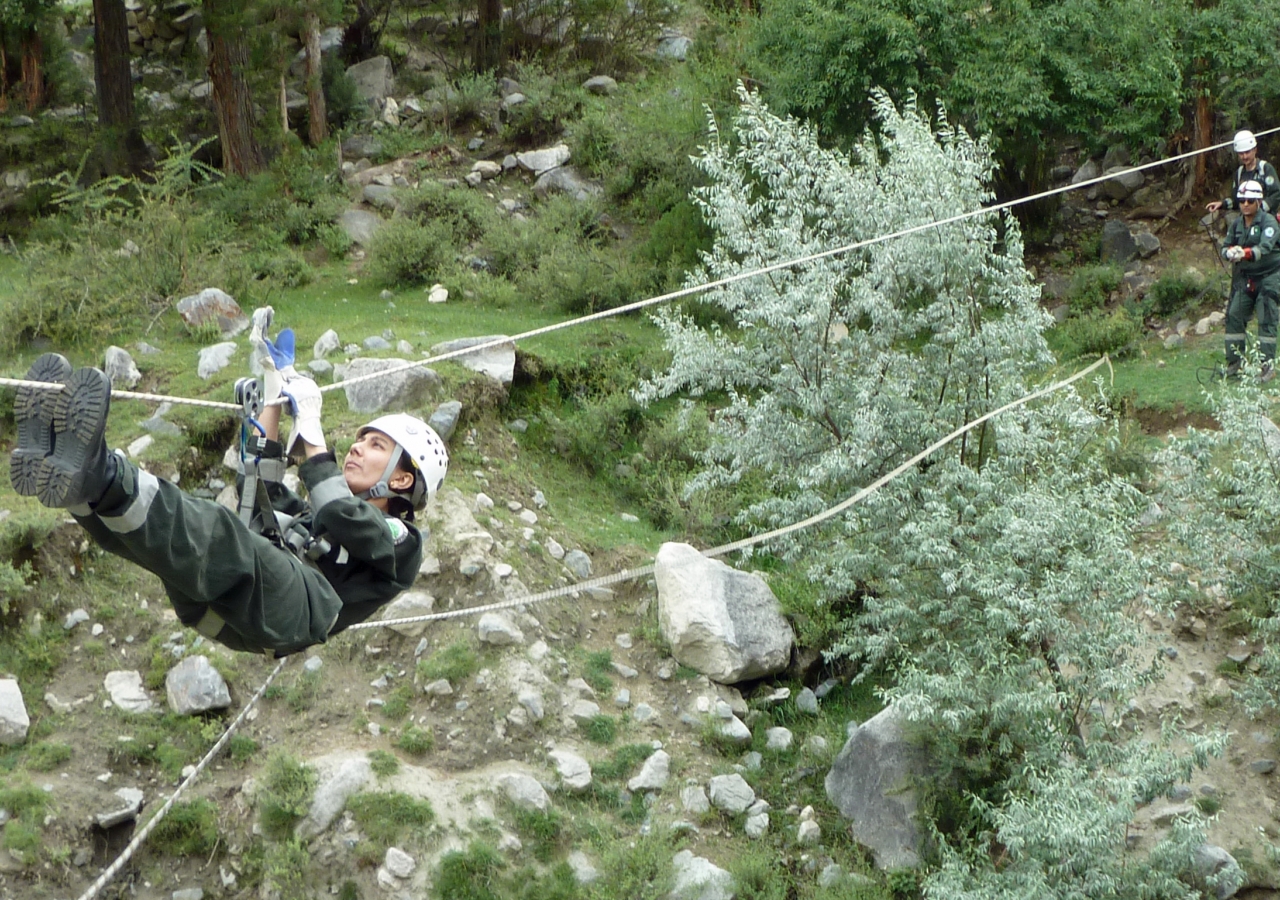 Fauzia of the FOCUS Search and Rescue Team, Gilgit demonstrates an evacuation technique.