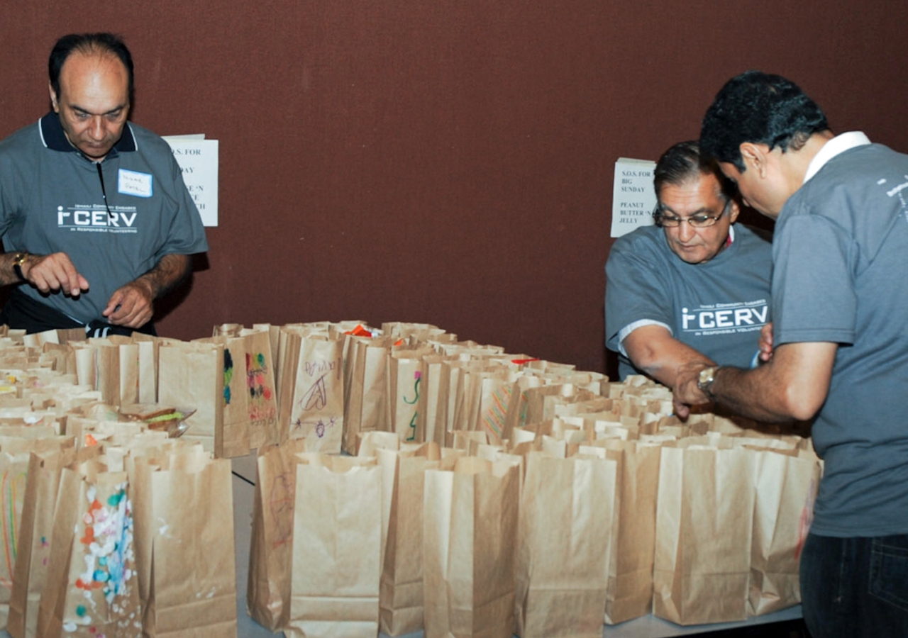 Ismaili volunteers pack food items for a Community Food Resource programme in the United States.