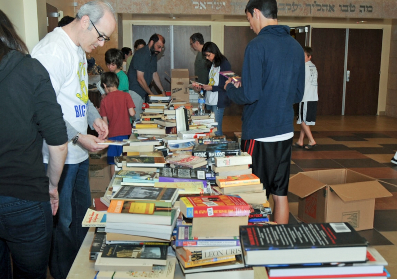 Ismaili I-CERV volunteers sort used books for distribution to inner-city schools in the United States.