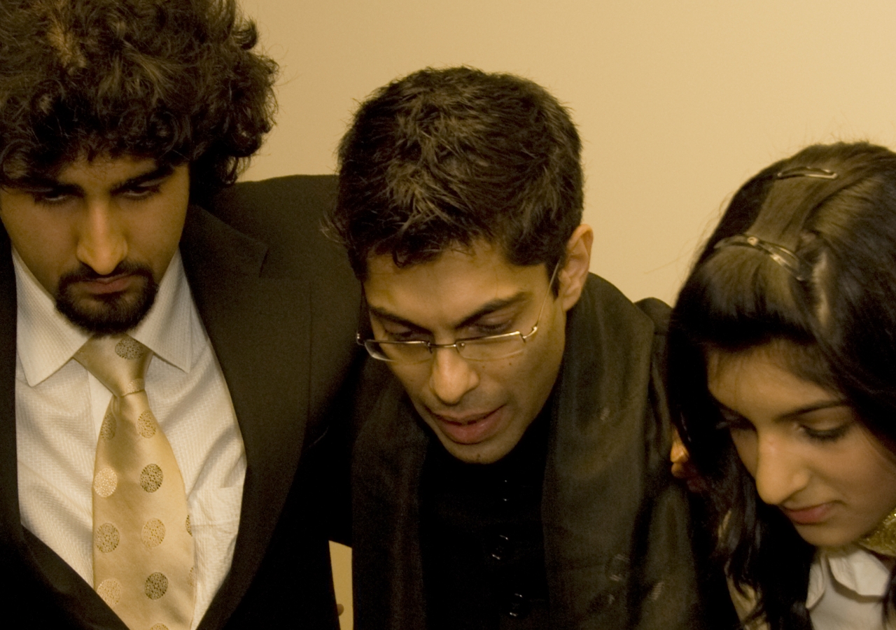 Hussein Janmohamed (centre) in a pre-show huddle with members of the Canadian Ismaili Muslim Youth Choir at a performence in Edmonton.