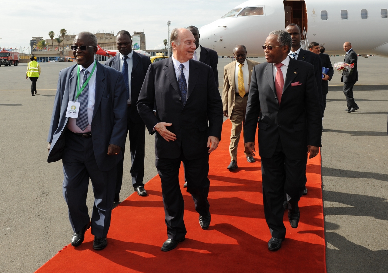 Mawlana Hazar Imam is accompanied by Kenyan ministers Hon Ali Chirau Mwakwere and Professor Sam Ongeri upon his arrival at Jomo Kenyatta International Airport.