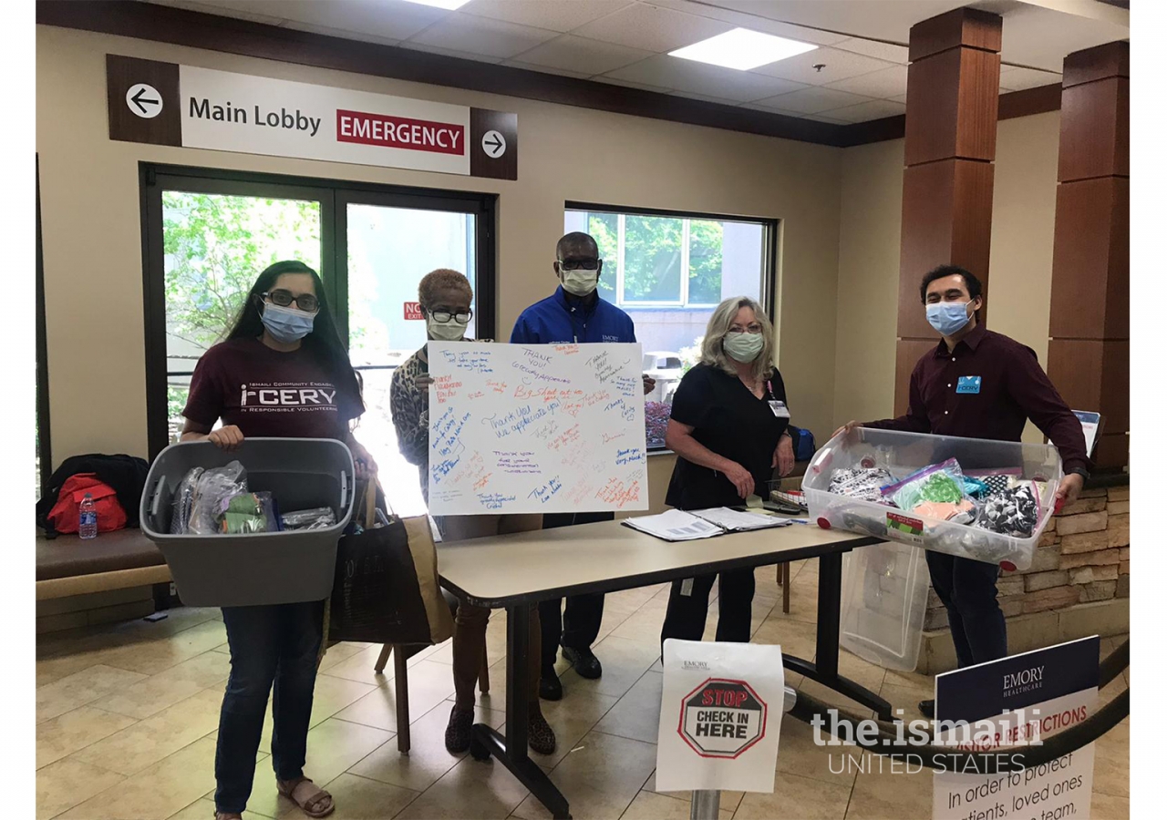 Emory staff receiving masks and thank you notes made by I-CERV volunteers in Atlanta.