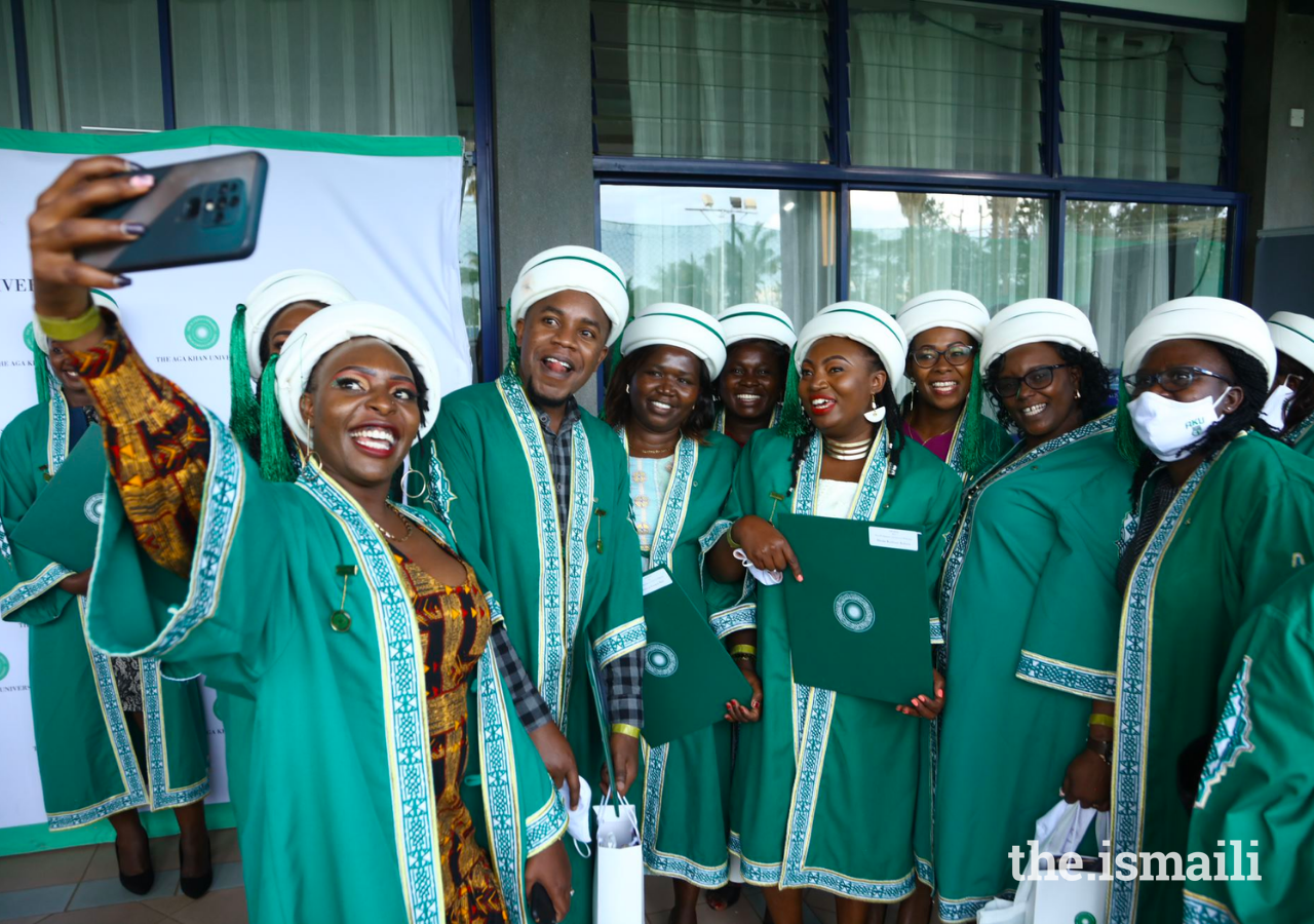 Graduands pose for a group photograph at the AKU convocation ceremony on 26 February 2022.